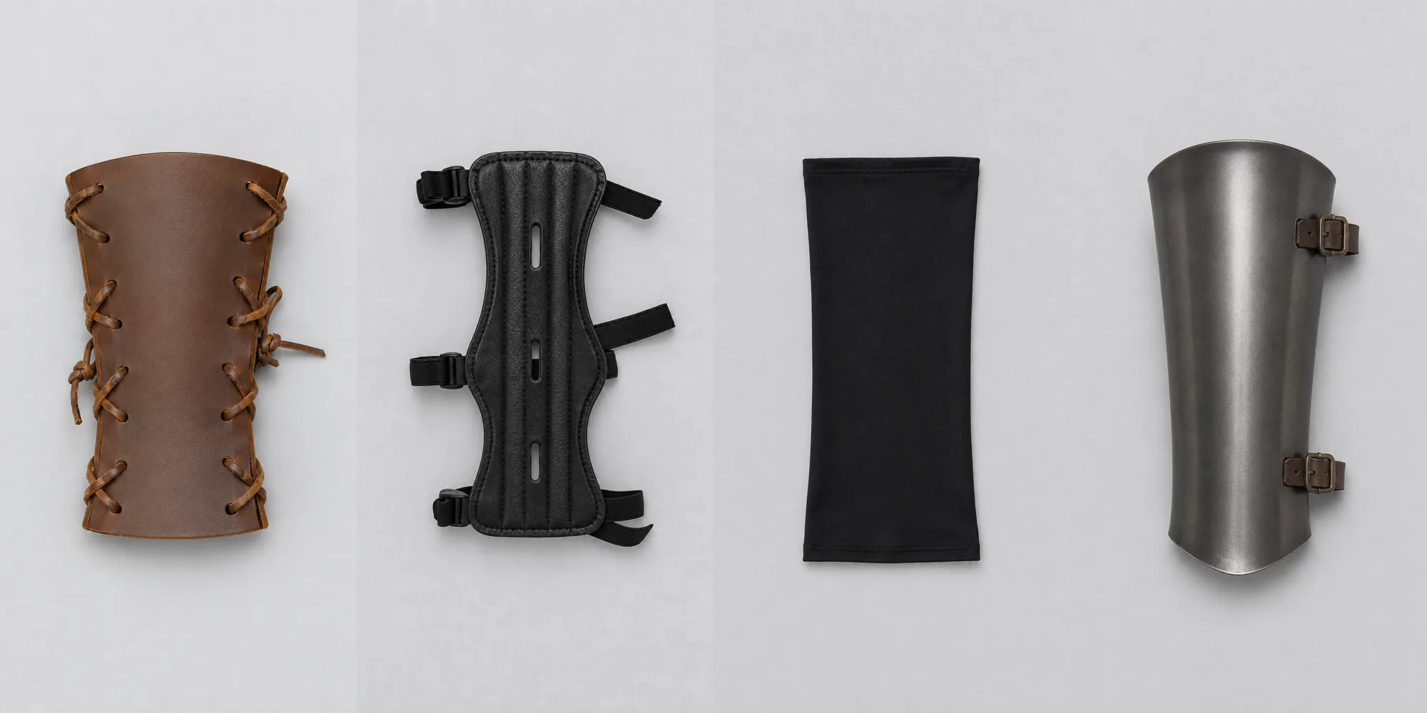 Four items compared flat, a leather bracer, the modern arm guard, an elastic sleeve and a steel vambrace
